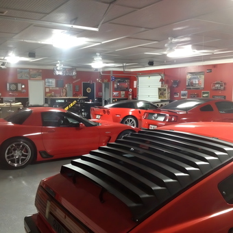 Red Sports Cars and Wall Art in Custom Garage - Bill from Woodstock, GA