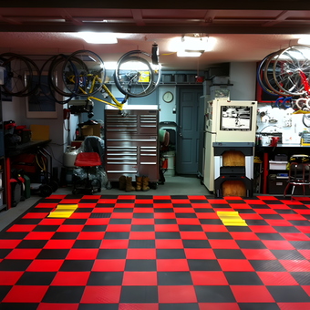 Organized Garage with Red Black Floor Tiles - Tractor Boy from Arlington, TX
