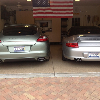 Clean garage with two Porsche cars and storage cabinets - Alan & Bonnie Miller from Bluffton, SC