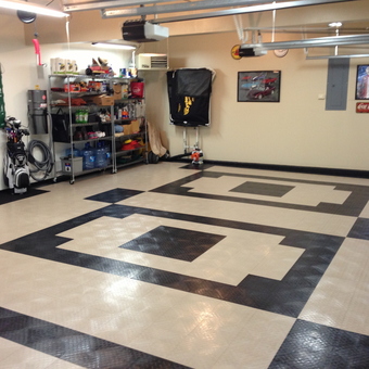 Organized garage with tile flooring and wall decor - Frank from Lehigh Valley, PA