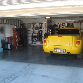 Organized garage with yellow Chevy SSR and wall storage - Terry from Pahrump, NV
