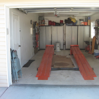 Organized garage with car lift, cabinets, tools - Terry from Pahrump, NV