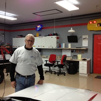 Organized garage with red accents and car workspace - Mike from Bowling Green, KY
