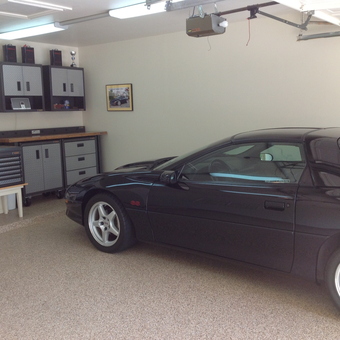 Organized garage with cabinets, workbench, and Camaro - Keith from La Porte, TX