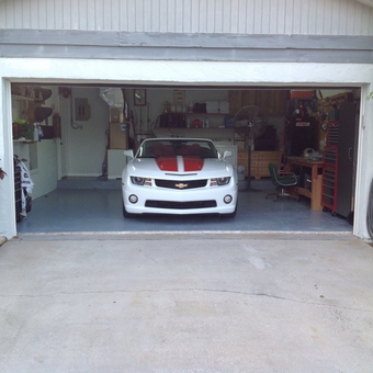Organized Garage With Camaro, Storage, and Workbench - Lark's from Wellington, FL