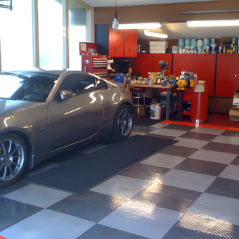 Organized garage with checkered floor and red cabinets - Marty from South Bend, IN