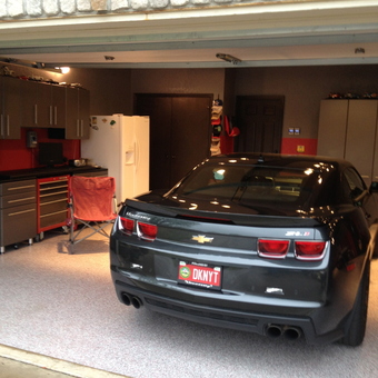 Modern garage with black Camaro, cabinets, and tool chest - Foosdaddy from Tulsa, OK