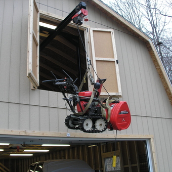 Garage Hoist Lifting Honda Snowblower into Loft Space - mansko