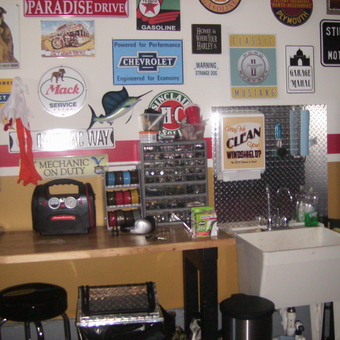 Garage Decor With Signs, Workbench, And Utility Sink - Cisco's Garage from Aroda, VA
