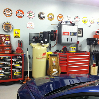 Organized garage with red tool chests and wall signs - Coz from Laflin, PA