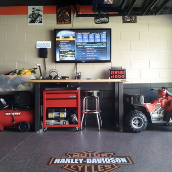 Organized garage workspace with Craftsman tools and Harley decor - Guardog ManCave from Ocoee, FL