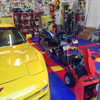 Colorful Garage with Corvette, Motorcycles, Tools - Kidzdent from Meadowbrook, PA