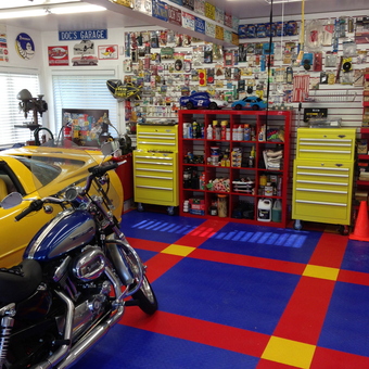 Colorful garage with yellow tool chests and motorcycle - Kidzdent from Meadowbrook, PA