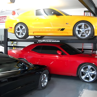 Garage with Car Lift Storing Three Sports Cars - Daniel from Quebec, Canada