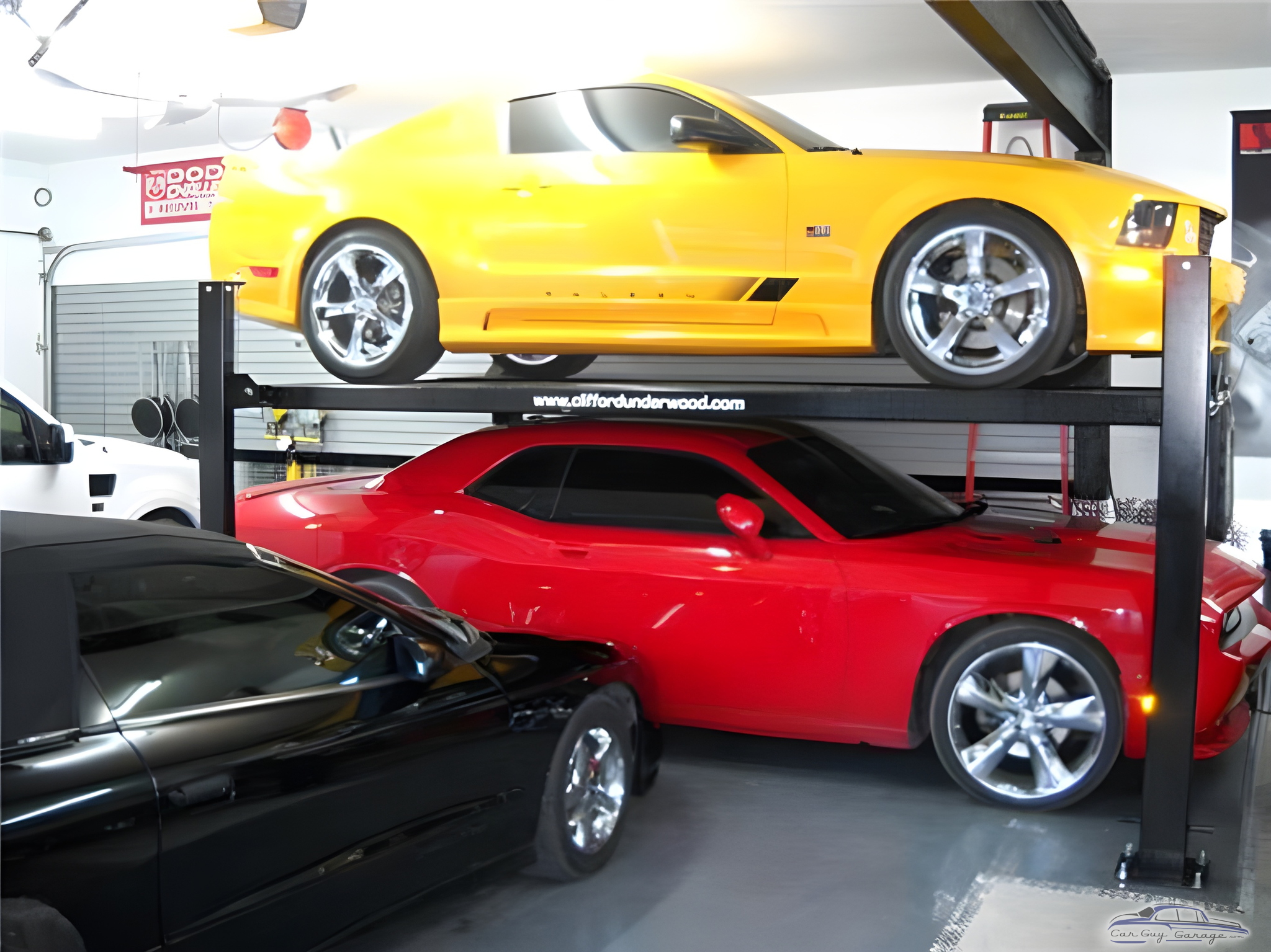 Garage with Car Lift Storing Three Sports Cars - Daniel from Quebec, Canada