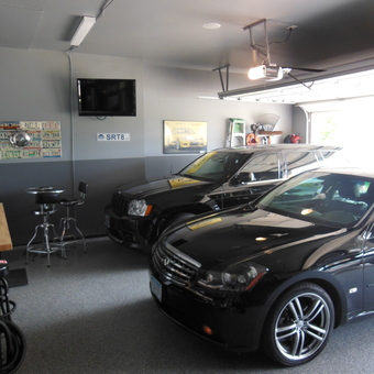 Modern Garage with Black Cars and Bar Stools - 1000 HP Garage from Plymouth, MN