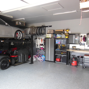 Organized garage with car lift and cabinets - 1000 HP Garage from Plymouth, MN