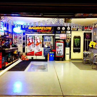 Colorful garage with bar stools, signs, and tool storage - Pargaz from Newman, CA