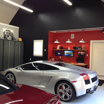 Modern garage with luxury cars and storage cabinets - Rich White