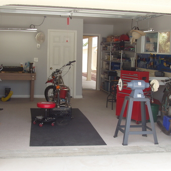 Organized motorcycle garage with tool storage and workbench - Rick from Yucca Valley, CA