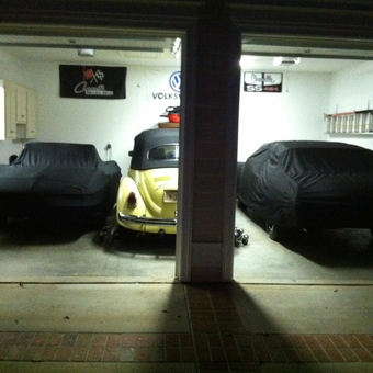 Three classic cars with covers and garage decor - Ed from Raleigh, NC