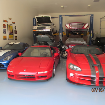 Luxury garage with sports cars, car lifts, and wall art - Ron from Glendale, AZ