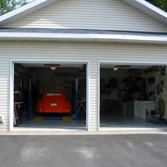 Organized Two-Car Garage With Car Lift and Cabinets - racer from St-Felix-de-Valois, Quebec, Canada