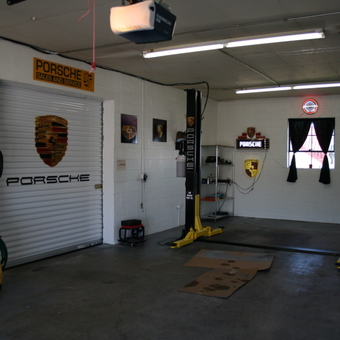 Porsche themed garage with car lift and wall decor - Brett from Lititz, PA