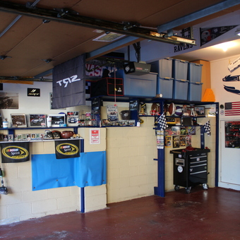 Organized garage with storage bins, tool chest, and racing decor - RockSRT from Verona, NJ