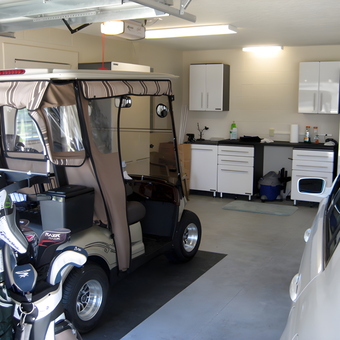 Organized Garage with Golf Cart, Cabinets, and Car - RL from The Villages, FL