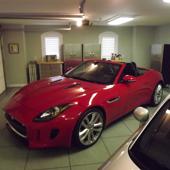 Modern garage with red convertible and storage cabinets - RR from Savannah, GA