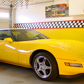Yellow Corvette in Garage with Checkered Wall Decor - Joe from Santee, CA