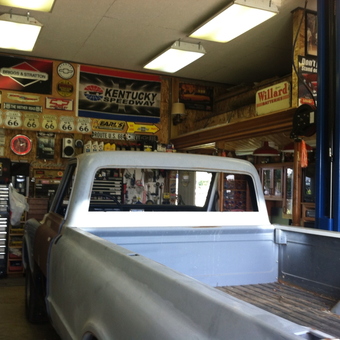 Classic Truck Restoration Garage with Route 66 Signs - Frank