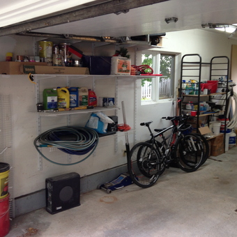 Organized garage with shelving, hoses, and bikes - Fastphil from Ste-Marthe-sur-le-Lac