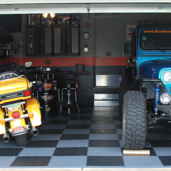 Checkered Garage Flooring with Vehicles and Storage Cabinets - Flooring