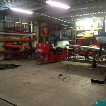 Organized garage with kayak racks, tool chests, and airplane - Jeromie from Richland, WA