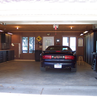 Organized garage with tool cabinets and sports car - Papa Mike from Chester, SD