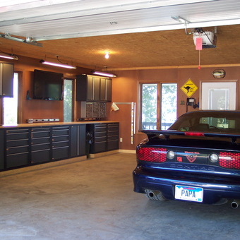 Organized Garage With Cabinets, Workbench, TV, and Pontiac - Papa Mike from Chester, SD