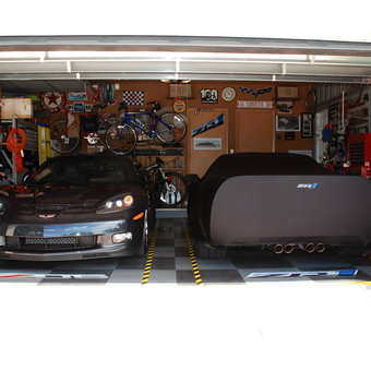 Organized garage with Corvettes, storage, and wall decor - Herb from Coral Springs, FL