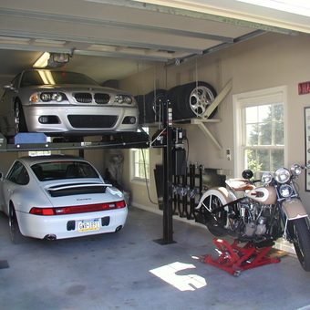 Organized garage with car lift, tire rack, and motorcycle lift - Michael Jarosik from Slatington, PA