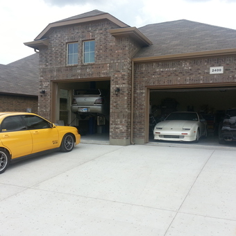Home garage with car lift, sports cars, and tools - Squidz from Fort Worth, TX