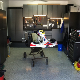 Organized garage with cabinets and go-kart - Newt's Haven from Aurora, CO