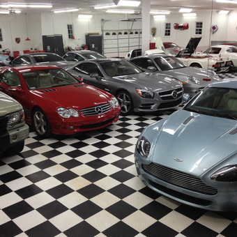 Luxury Cars in Checkerboard Floor Garage - Jim