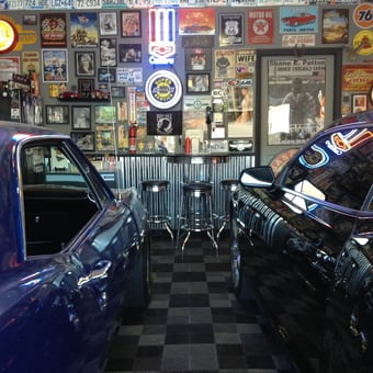 Classic Garage with Neon Signs and Bar Stools - Dixon