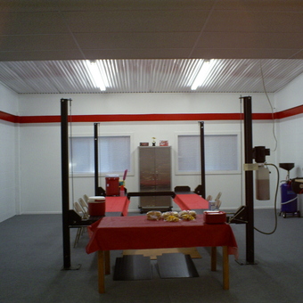 Organized garage with car lift and storage cabinet - Tommy from Dadeville, AL