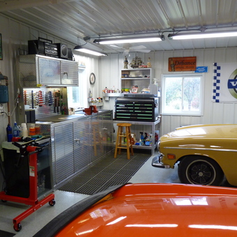 Organized garage with metal cabinets and Volvo decor - Dave from Marshalltown, Iowa