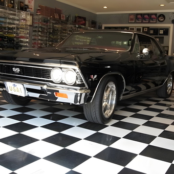 Classic Car Display with Checkered Floor and Wall Art - Johnny from Centerville, GA