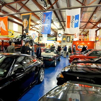 Classic Car Garage with Automotive Banners and Signs - Tony B.