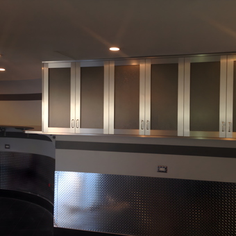 Modern garage with metal cabinets and diamond plate panels - Michael from Malba, NY