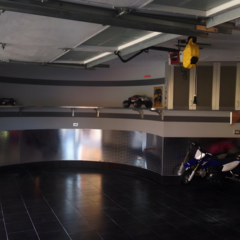 Modern garage with diamond plate walls and ATVs - Michael from Malba, NY